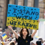 People take part during a solidarity march in London for Ukraine, following the Russian invasion.