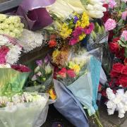 Flowers are laid in tribute to Romaria Opia, 15, who was stabbed in Holland Walk,  on the Elthorne Estate in Archway