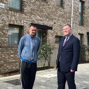Islington resident John Lowe and Cllr Ward with some of the newly built council housing at Dover Court
