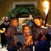 Carols on the steps outside St Mary's, Islington. Pictured are Rosalind Myers, Frankie Erskine and Harriet Middleton