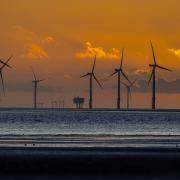A wind farm in north west England. Climate change should be treated as an emergency in the same way as the Covid-19 pandemic, according a study from the Glasgow Caledonian University Centre for Climate Justice published in July