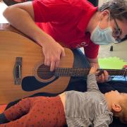 Isabella enjoying a music therapy session