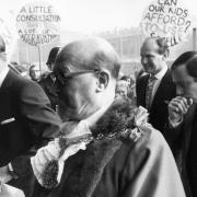 Banner-waving demonstrators greet the Duke of Edinburgh as he arrives to open the new £2m Michael Sobell Sports Centre in Hornsey Road in November 1973