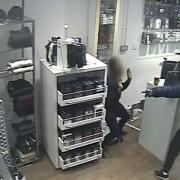 Sheraji threatening the staff member with a knife. Picture: Met Police