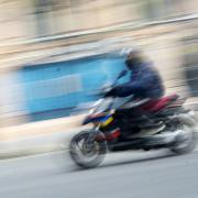 A stock moped rider image. Picture: Victoria Jones/PA