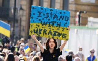 People take part during a solidarity march in London for Ukraine, following the Russian invasion.